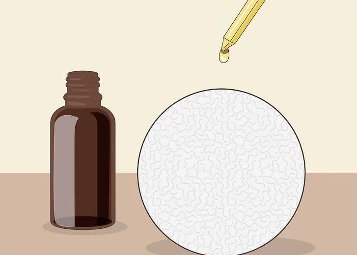 Bước 2: Thêm tinh dầu vào bóng sấy len nếu bạn muốn làm thơm quần áo