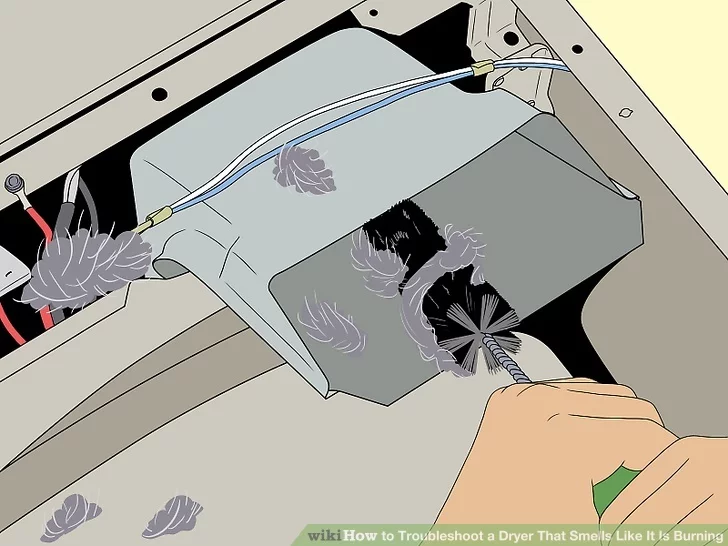 Sử dụng bàn chải máy sấy để loại bỏ xơ vải