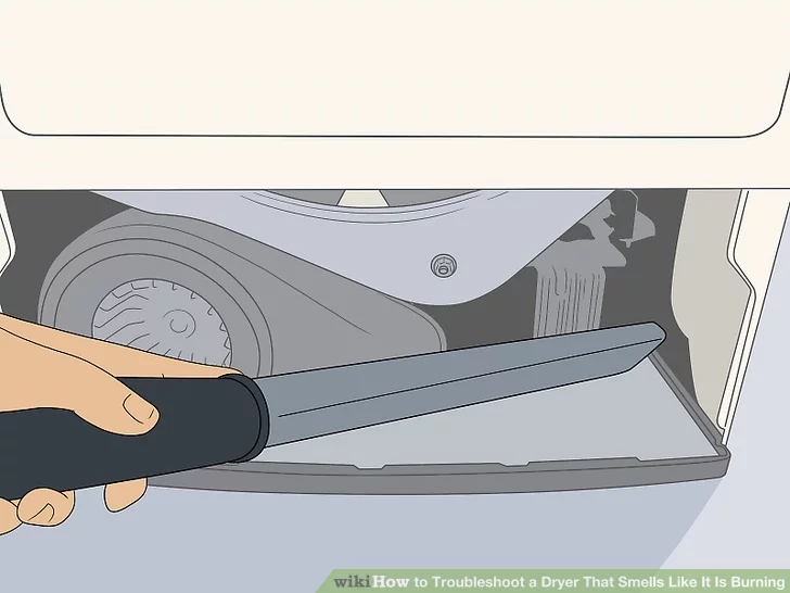 Hút xơ vải tích tụ - nguyên nhân gây ra sự cố máy sấy quần áo có mùi khét